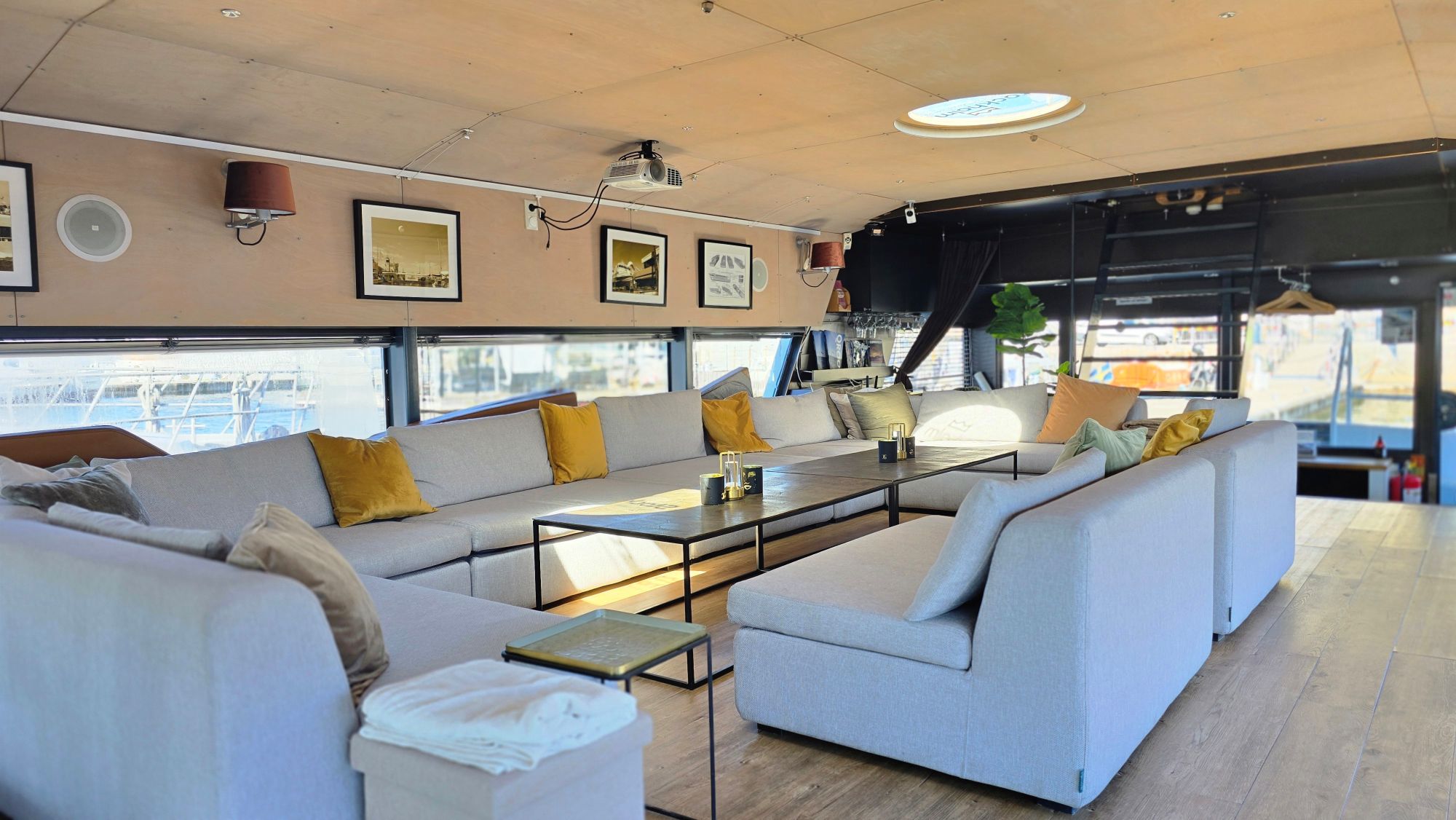 Lounge seating area inside the QROOZ event boat